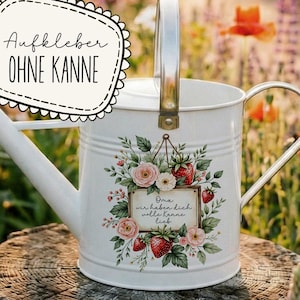 May include: White metal watering can with a silver handle and a floral design featuring pink roses and red strawberries. The can has a decorative label with the text "Oma wir haben dich volle kanne lieb."