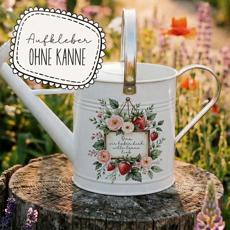 May include: White metal watering can with a silver handle and a floral design featuring pink roses and red strawberries. The can has a decorative label with the text "Oma wir haben dich volle kanne lieb."
