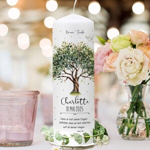 May include: White baptism candle with a watercolor illustration of a tree with green leaves and a dove. The candle has the text "Deine Taufe" at the top, "Charlotte" in the middle, and "18.MAI 2025" below the name. The text "Denn er hat seinen Engeln befohlen, dass sie dich beh&uuml;ten auf all deinen Wegen Psalm 91:11" is at the bottom.