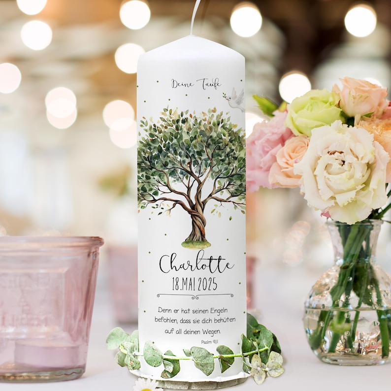 May include: White baptism candle with a watercolor illustration of a tree with green leaves and a dove. The candle has the text "Deine Taufe" at the top, "Charlotte" in the middle, and "18.MAI 2025" below the name. The text "Denn er hat seinen Engeln befohlen, dass sie dich beh&uuml;ten auf all deinen Wegen Psalm 91:11" is at the bottom.