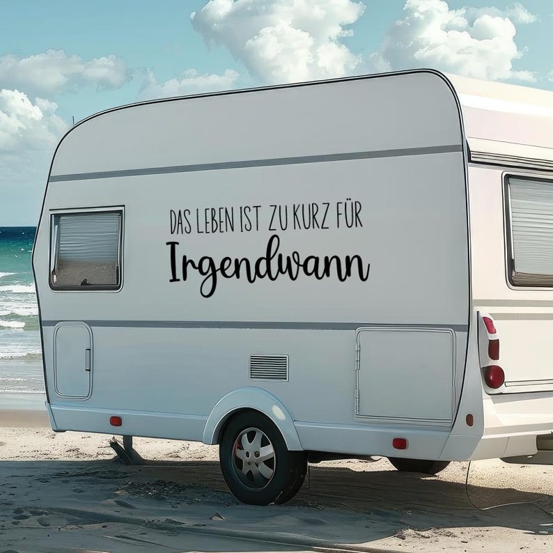 May include: A white camper van with the text "DAS LEBEN IST ZU KURZ F&Uuml;R IRGENDWANN" on the side.