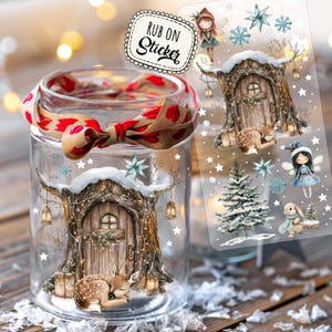 May include: A clear glass jar adorned with a fairy tale design, with a red and tan ribbon tied around the rim. A sheet of rub-on stickers with fairy tale illustrations is visible next to the jar. The jar is decorated with a fairy tale scene.