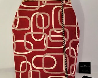 Handmade bag with vintage bronze click clac closure.