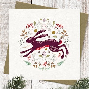 Kerstkaart rennende haas | Wenskaart noordse winterhazen | Kerstkaart in Scandinavische volkskunststijl | Illustratie in het wild