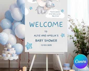 May include: A rectangular light gray welcome sign for a baby shower featuring a cartoon elephant, blue stars, and white clouds. The text reads: Welcome to Alfie and Amelia's baby shower 12/03/2025, along with the quote: You're so precious to me.