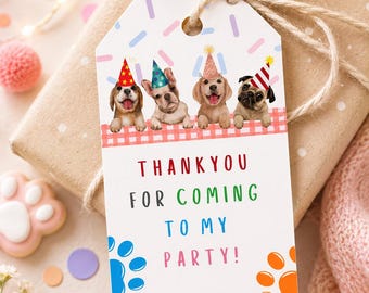 May include: A rectangular white gift tag featuring four puppies wearing colorful party hats above a red and white checkered border. The text reads THANK YOU FOR COMING TO MY PARTY! in multi-colored letters, with blue and orange paw prints below.