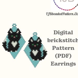 May include: Digital brickstitch pattern for earrings. The image shows two black and white cat earrings with green eyes, set on a light blue diamond-shaped background. The earrings are part of a digital PDF pattern available on Etsy.