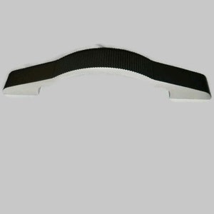 May include: A black plastic handle with a curved shape. The handle is designed for use on a drawer or cabinet.