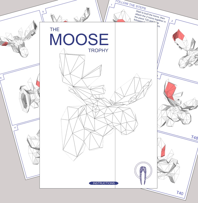 K&ouml;nnte beinhalten: Eine Schwarzwei&szlig;-Zeichnung eines Elchkopf-Troph&auml;ens. Die Zeichnung besteht aus Dreiecken und ist mit "The Moose Trophy" beschriftet. Das Bild enth&auml;lt Anweisungen zum Bau der Troph&auml;e.