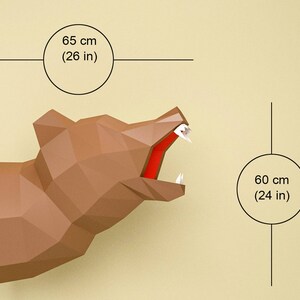 May include: A brown papercraft bear head with an open mouth, 26 inches wide and 24 inches tall. The bear's head is made of folded paper and has a realistic appearance.