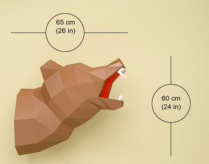 May include: A brown papercraft bear head with an open mouth, 26 inches wide and 24 inches tall. The bear's head is made of folded paper and has a realistic appearance.