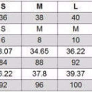 May include: Size chart for clothing with measurements in inches and centimeters. The chart includes international sizes, EU sizes, US sizes, chest size, and hip size.