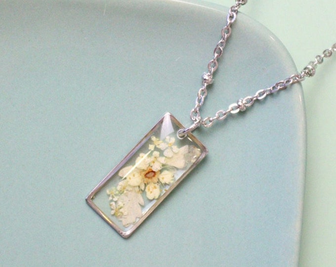 Stainless steel heart necklace and resin pendant with white flower and Queen Anne's Lace