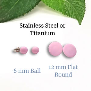 May include: A selection of pink stud earrings. The image shows two 6 mm ball earrings and two 12 mm flat round earrings. The text in the image reads "Stainless Steel or Titanium".