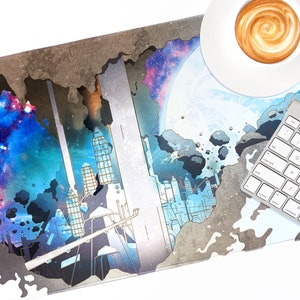 May include: A grey and white mouse mat with a galaxy and city skyline design. The mouse mat has a distressed, cracked look. A white keyboard and a white cup of coffee are on the mouse mat.