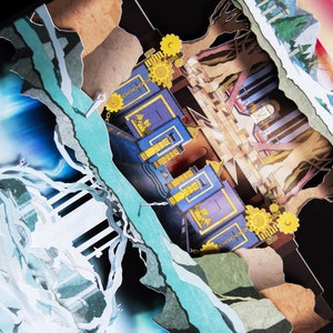 May include: A papercraft scene with a blue and gold building, a forest, and a waterfall. The scene is made of paper and has a 3D effect.
