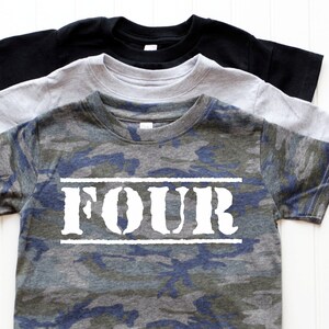 May include: Camouflage t-shirt with the word "FOUR" printed in white on the front. The shirt is available in three colors: black, gray, and blue.