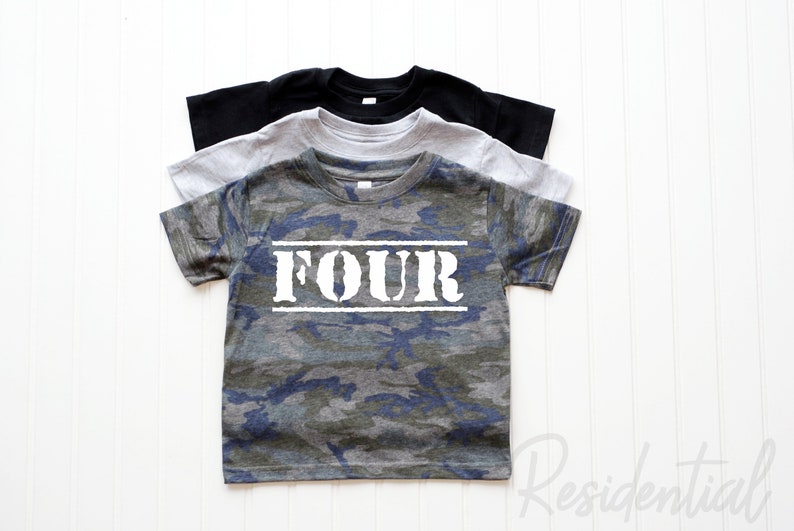 May include: Camouflage t-shirt with the word "FOUR" printed in white on the front. The shirt is available in three colors: black, gray, and blue.