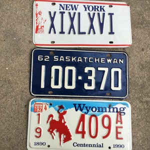 Vintage State License Plate: New York, Saskatchewan, Wyoming