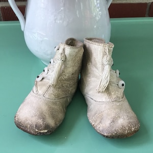 Antique button up baby shoes with tassel