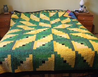 Log cabin with starburst pattern.