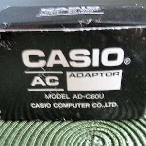 CASIO ac power supply charger adapter model ad-c6ou output 6 vdc
