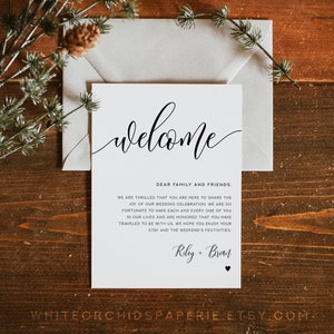 May include: A white card with black text that reads "Welcome" in a cursive font. The text below reads "Dear family and friends. We are thrilled that you are here to share the joy of our wedding celebration. We are so fortunate to have each and everyone of you in our lives and are honored that you have traveled to be with us. We hope you enjoy your stay and the weekend's festivities. Riley + Brian".