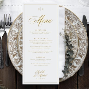 May include: A vertical white menu card with gold text and a thin gold border. The menu features the word Menu, sections for Appetizer, Main Course, and Dessert, and the names Elizabeth & Michael with the date August 20, 20XX at the bottom.