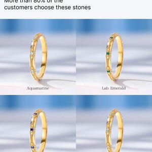 May include: Four gold rings with different colored gemstones. The rings feature a delicate design with small gemstones set in the band. The gemstones are aquamarine, lab emerald, natural sapphire, and natural diamond.