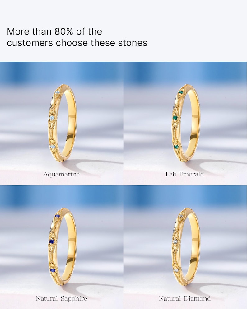 May include: Four gold rings with different colored gemstones. The rings feature a delicate design with small gemstones set in the band. The gemstones are aquamarine, lab emerald, natural sapphire, and natural diamond.