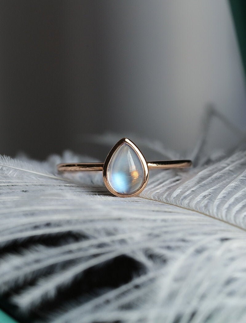 Engagement ring rose gold pear shaped moonstone bezel set image 0