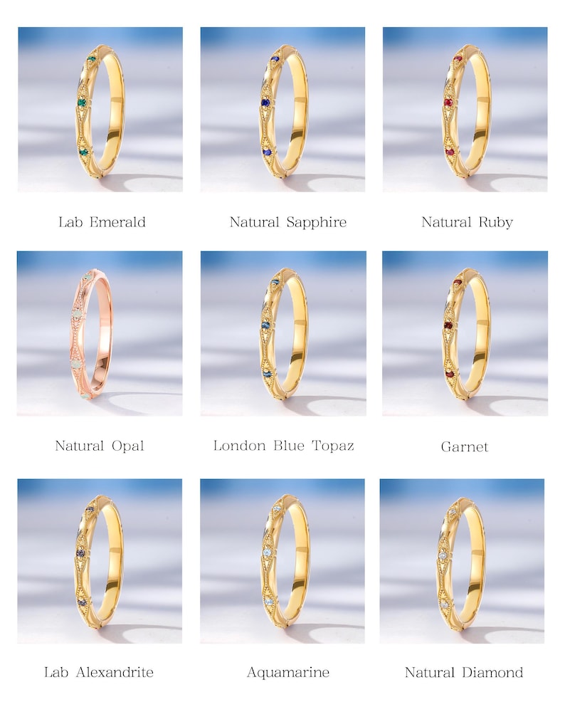 May include: A collection of nine thin metal rings featuring intricate engraved patterns and small, round-cut gemstones. The set includes lab emerald, natural sapphire, natural ruby, natural opal, London blue topaz, garnet, lab alexandrite, aquamarine, and natural diamond options.