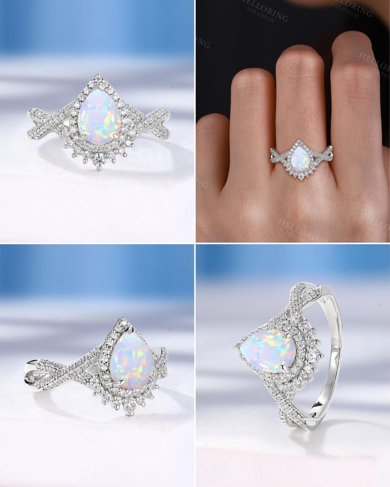 May include: A silver ring featuring a pear-shaped opal gemstone, surrounded by a halo of small, sparkling accent stones. The band has a delicate, twisted design, adding to the ring's elegant appearance. The ring is set against a light blue background.