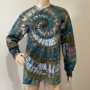 May include: Long-sleeved shirt with a tie-dye pattern in shades of green, blue, and white. The shirt has a spiral design.