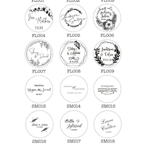 May include: A collection of 21 round wooden stamps with black ink. Each stamp features a different design with a couple's names and wedding date. The stamps are arranged in a grid pattern on a white background.