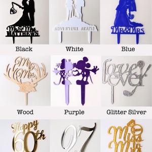May include: A selection of cake toppers in various colors and styles, including black, white, blue, wood, purple, glitter silver, mirror gold, mirror silver, and glitter gold. The toppers feature various designs, such as a couple getting married, a couple on an adventure, a Mickey Mouse and Minnie Mouse couple, the word "forever", a happy 60th birthday, the number 27, and a bride and groom.