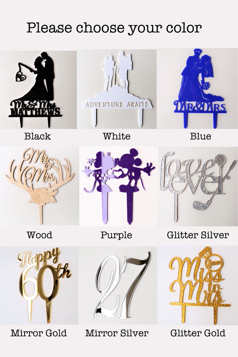 May include: A selection of cake toppers in various colors and styles, including black, white, blue, wood, purple, glitter silver, mirror gold, mirror silver, and glitter gold. The toppers feature various designs, such as a couple getting married, a couple on an adventure, a Mickey Mouse and Minnie Mouse couple, the word "forever", a happy 60th birthday, the number 27, and a bride and groom.