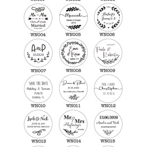 May include: A set of 18 round wooden stamps with black ink. Each stamp features a different design with a wedding theme, including names, dates, and wedding-related phrases. The stamps are arranged in a grid of six rows and three columns.