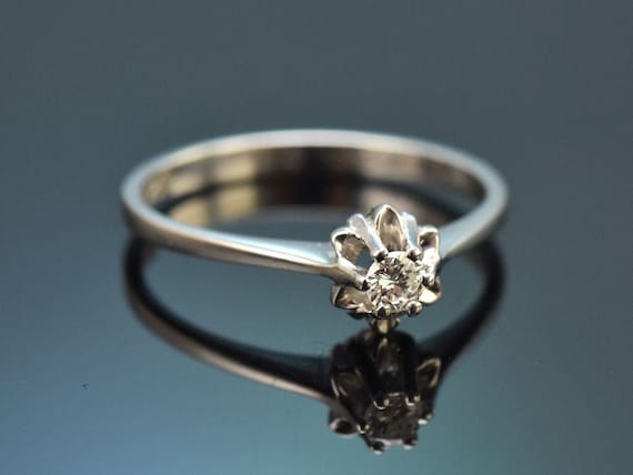 Delicate solitaire diamond engagement ring in whi… - image 1