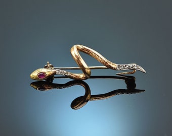 Snake brooch with ruby and diamond roses made of 585 yellow gold was created around 1900