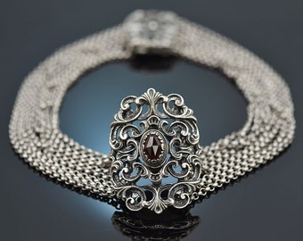Beautiful traditional goiter necklace with 8 rows of garnet and 835 silver from Austria around 1975