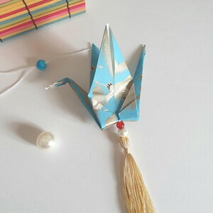 Decorative hanging pendant with a lucky origami crane