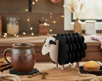 May include: A kitchen setting with a brown ceramic mug featuring a bull skull design, a black sheep-shaped coaster, and a decorative sheep. A small muffin is in a cast iron pan. The scene is set on a wooden cutting board.