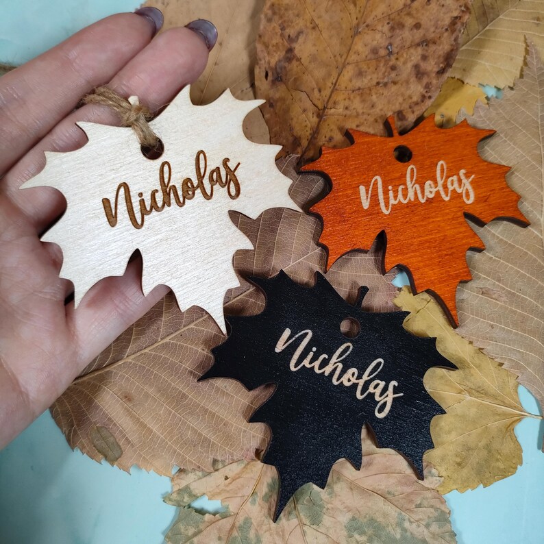 maple place cards
maple leaves tags
maple name tags bulk
custom maple cards
engraved place tags
thanksgiving cards
thanksgiving favors
fall name cards bulk
christmas ornaments
family ornaments
fall table decor
christmas tree decor
friendsgiving gifts
