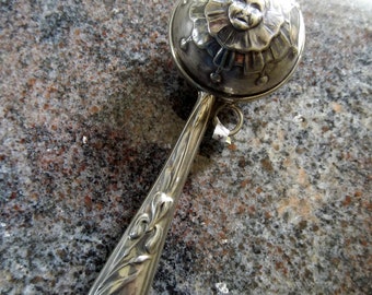 Double sided jester faced antique sterling silver rattle c.1900