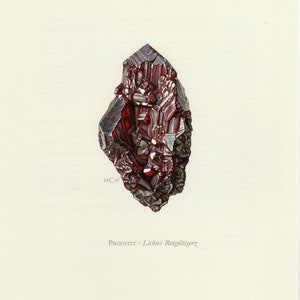 May include: A detailed illustration of a red proustite crystal, showcasing its intricate, faceted form. The crystal displays a dark base and a rich, reddish-purple colour. The text "PROUSTIT - Lichtes Rotgultigerz" is printed beneath the crystal.