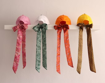 Baseball cap with silk bow