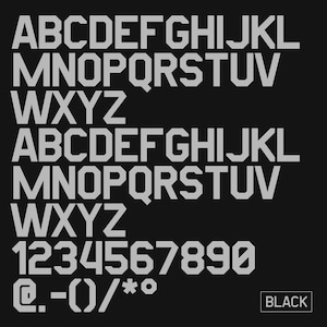 May include: A black background with the alphabet, numbers, and symbols in a light gray, blocky font. The word "BLACK" is in a white box in the bottom right corner.