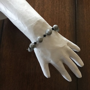Vintage with a twist, pebbles and bam bam,gray stone looking beads square lobster claw