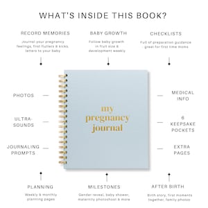 May include: A pale blue pregnancy journal with a gold spiral binding and gold lettering that reads "my pregnancy journal." The journal includes sections for recording memories, baby growth, checklists, photos, ultrasounds, journaling prompts, planning, milestones, medical info, keepsake pockets, and extra pages.
